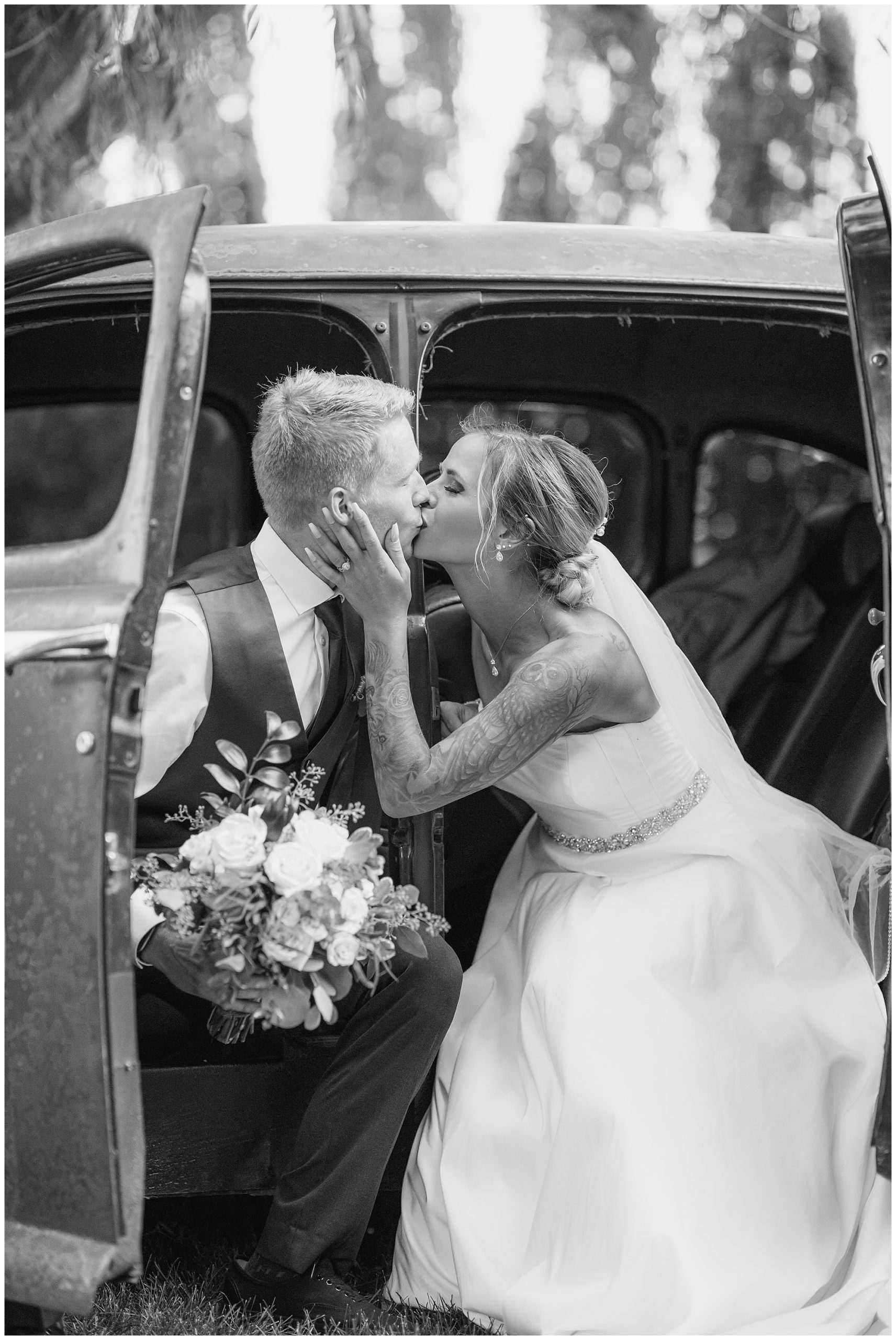 suicide door wedding kiss black and white 