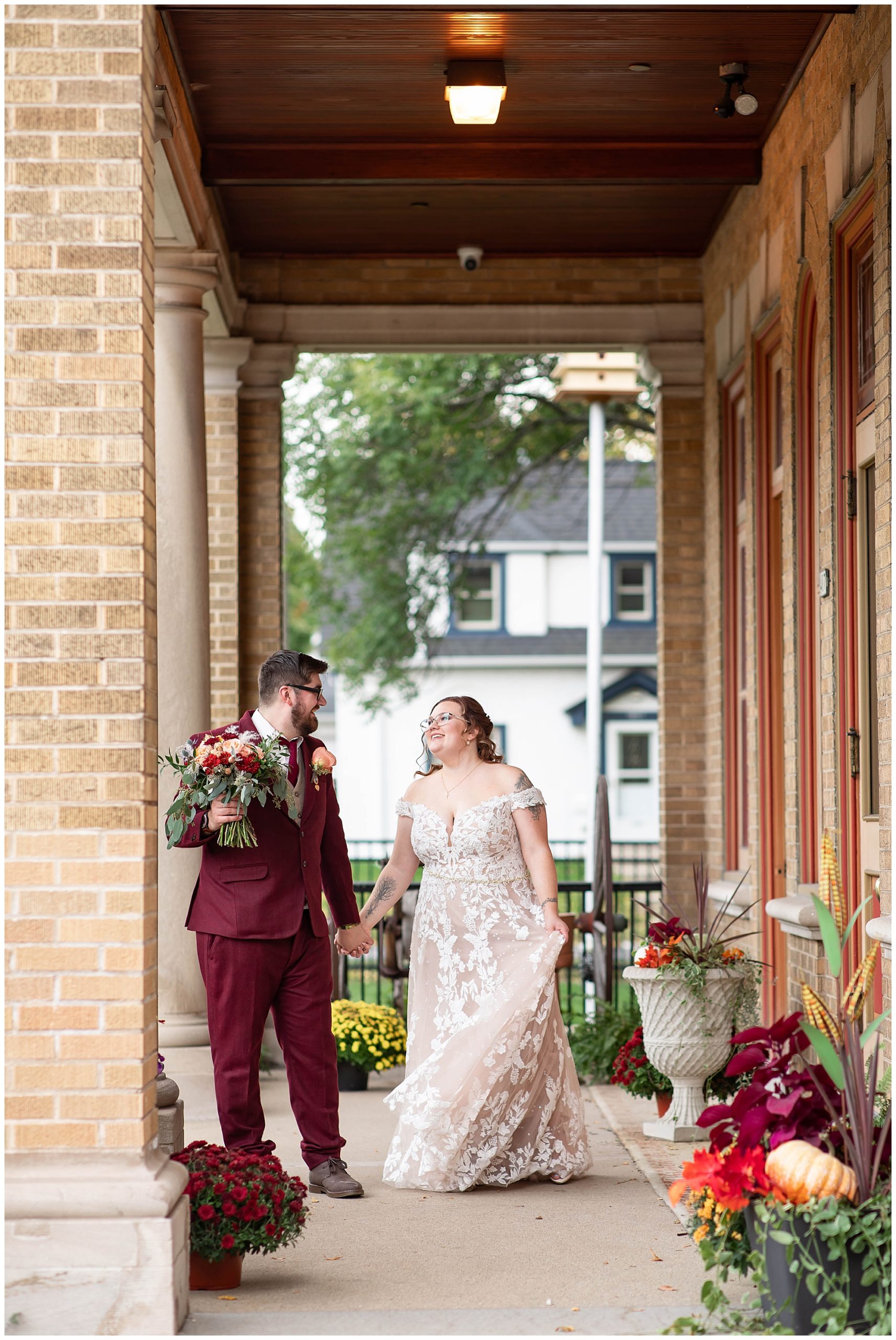 Couple's photos on front porch of Story Hill FireHouse during wedding 