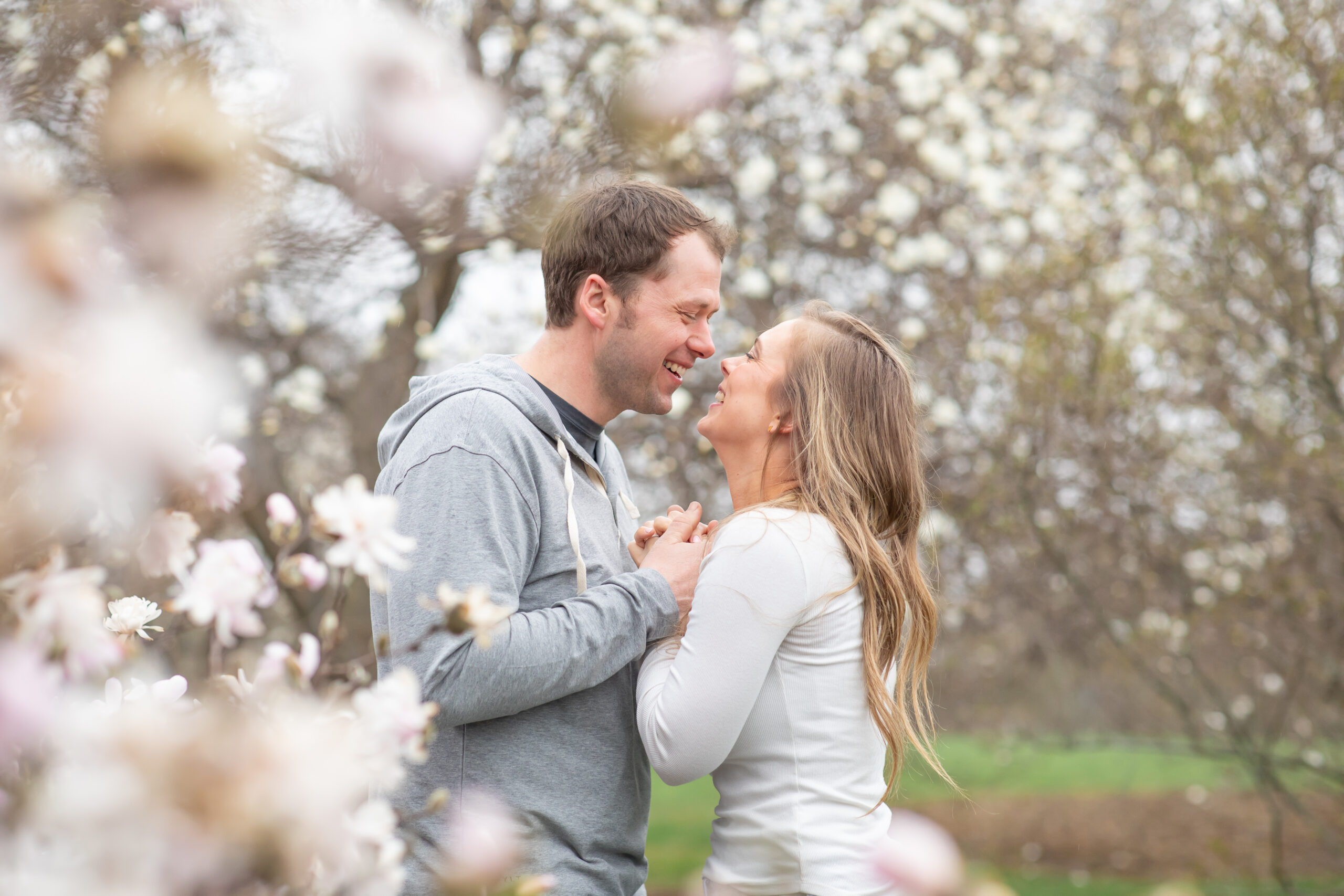 spring engagement photos in Madison WI at UW Arboretum during magnolia blooms with Kuffel Photography 