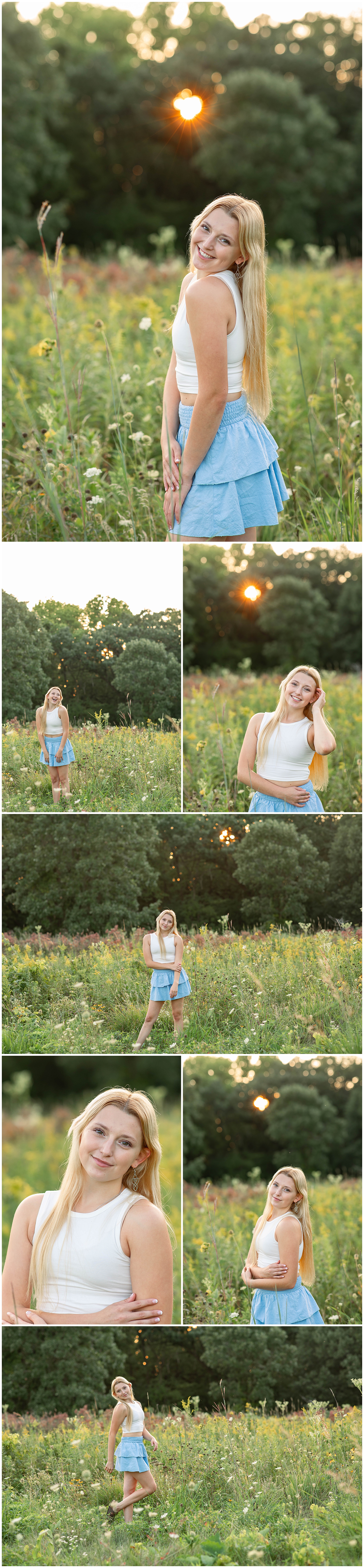 senior girl in white crop top and blue skirt posing in a field for senior photos 